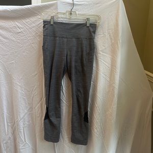 Grey and Black Lululemon 7/8 Leggings with Side Pockets and Calf Mesh Cutouts